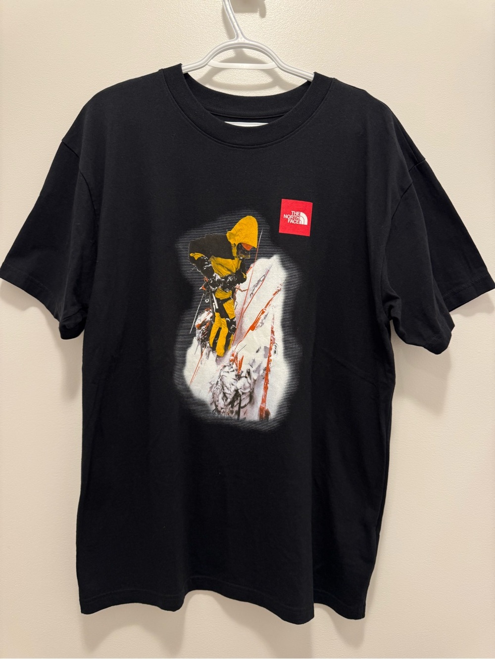 The North Face Black Tee with Yellow Mountain Graphic